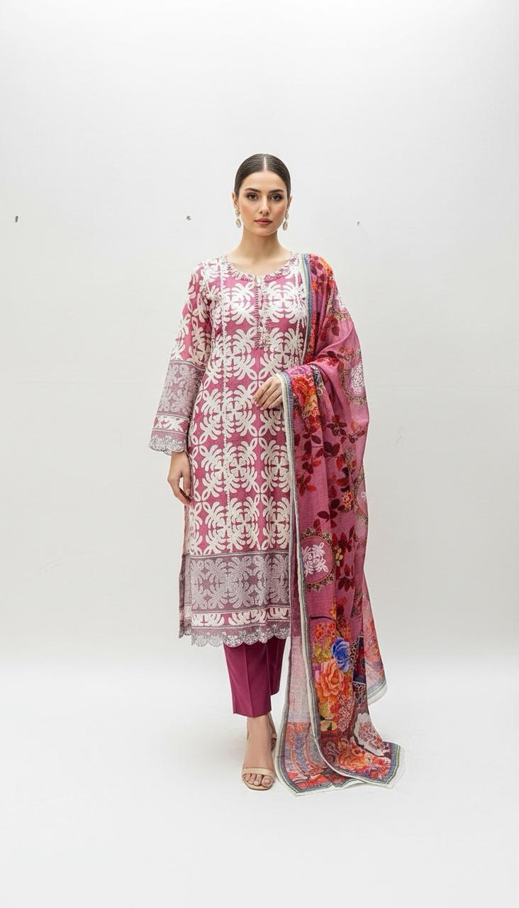 A woman poses against a white background in the Vibrant Patchwork Ensemble—a pink and white floral kurta, matching pink pants, and a colorful floral dupatta with stylish details—ideal for daytime occasions.