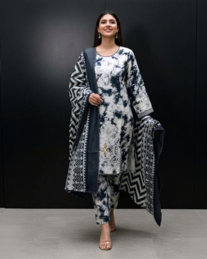Woman wearing a patterned outfit with a black background