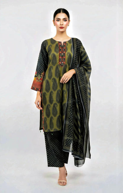 Woman wearing a green and black patterned outfit with a black dupatta on a white background