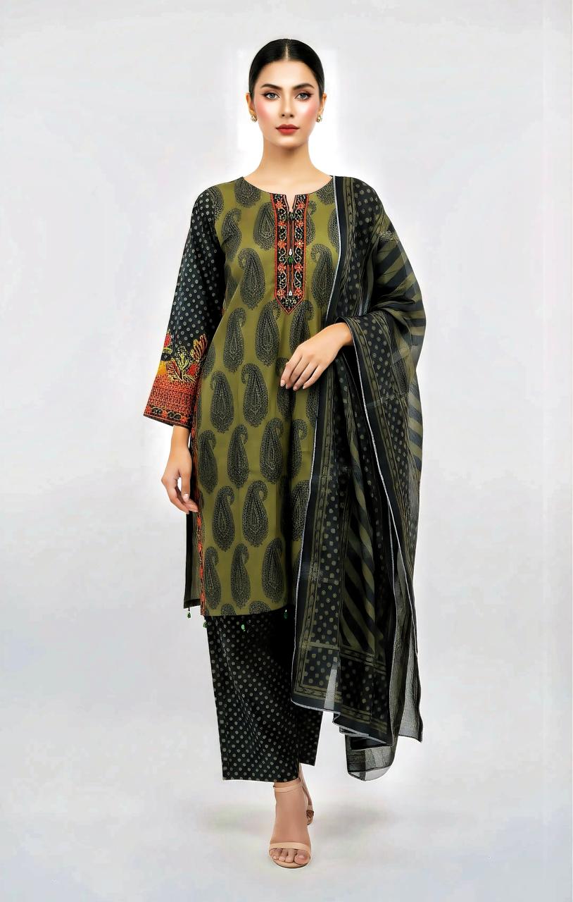 Woman wearing a green and black patterned outfit with a black dupatta on a white background