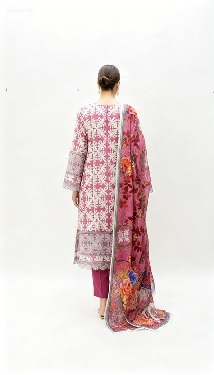 A woman, seen from the back, wears the Vibrant Patchwork Ensemble: a pink and white patterned kurta with matching pants and a floral dupatta with stylish details—ideal for daytime occasions—set against a plain white background.
