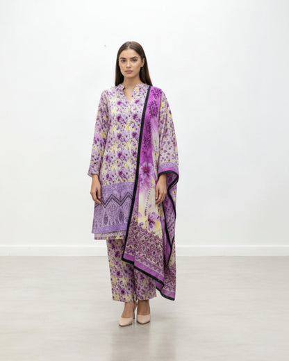 Woman wearing a purple and white floral outfit with a matching scarf on a white background